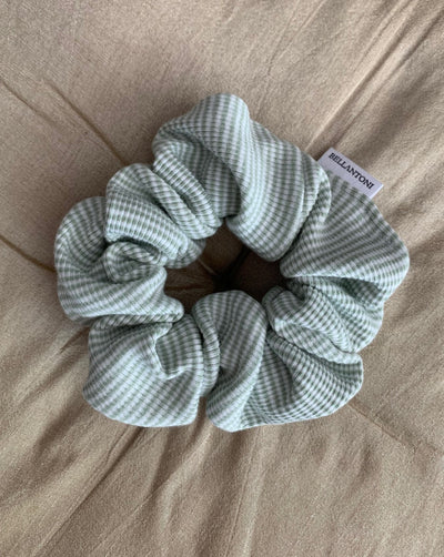 Reclaimed cotton sage green and white striped scrunchie, ethically handmade in Canada.
