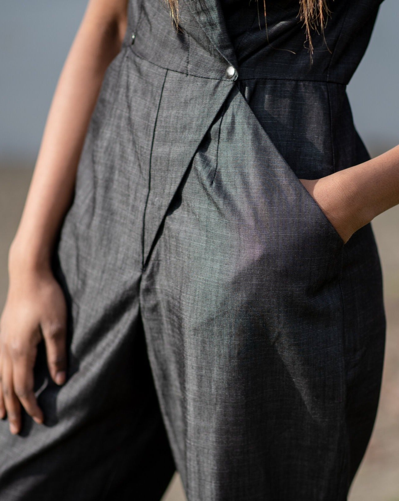 Black Tencel denim pantsuit with metal clasps.