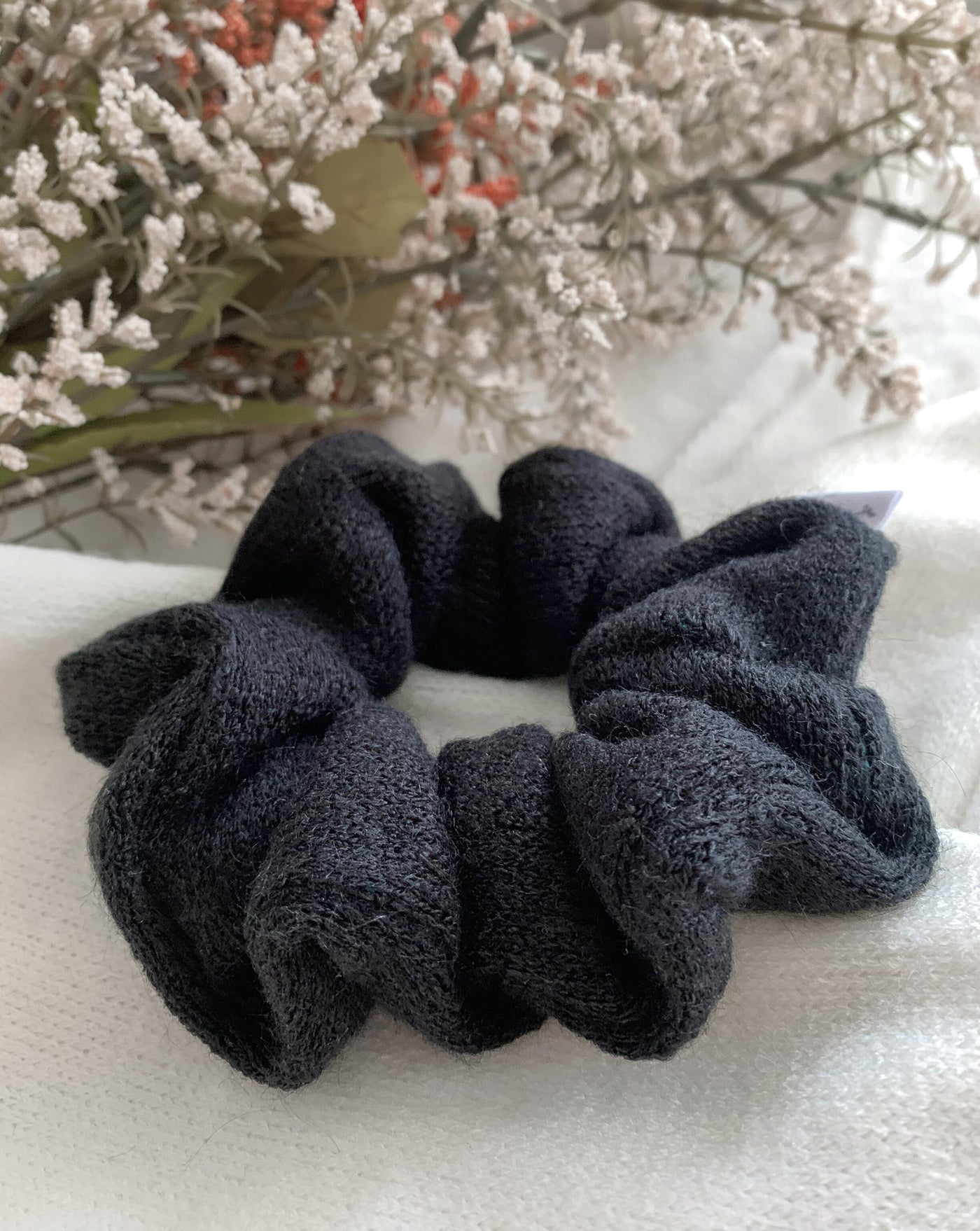 Black reclaimed sweater scrunchie ethically sewn in Canada.