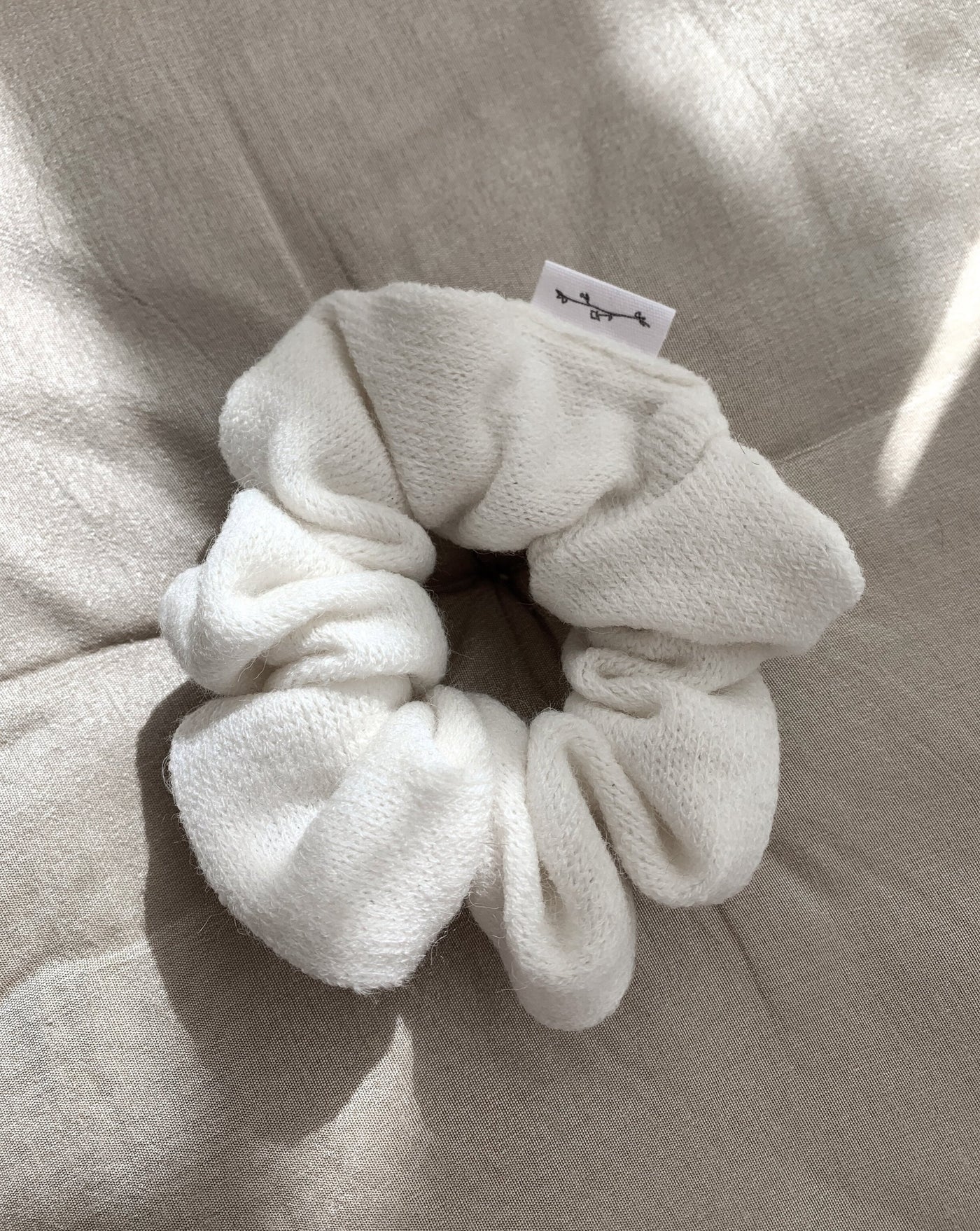 Cream oversized reclaimed sweater scrunchie ethically sewn in Canada.
