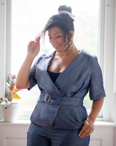 Blue chambray Tencel denim pantsuit with coconut shell buckle belt.
