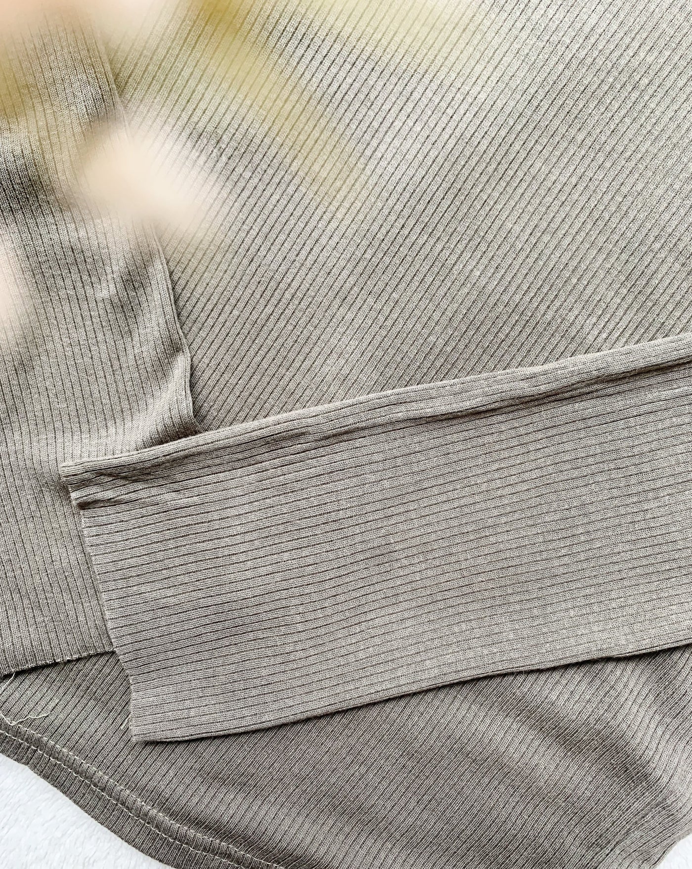 Ribbed Tencel Turtleneck in the colour Olive Green.