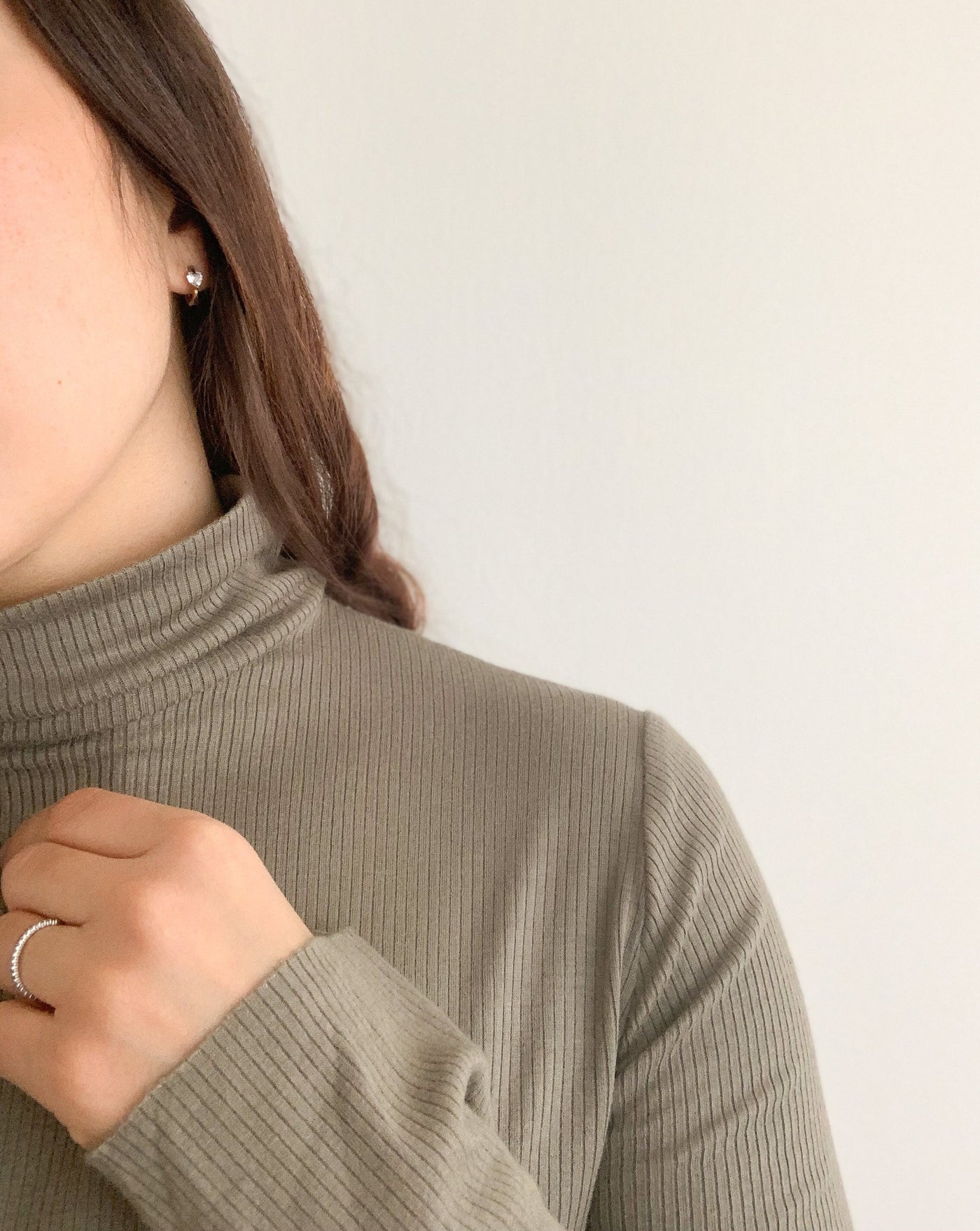 Ribbed Tencel Turtleneck in the colour Olive Green.