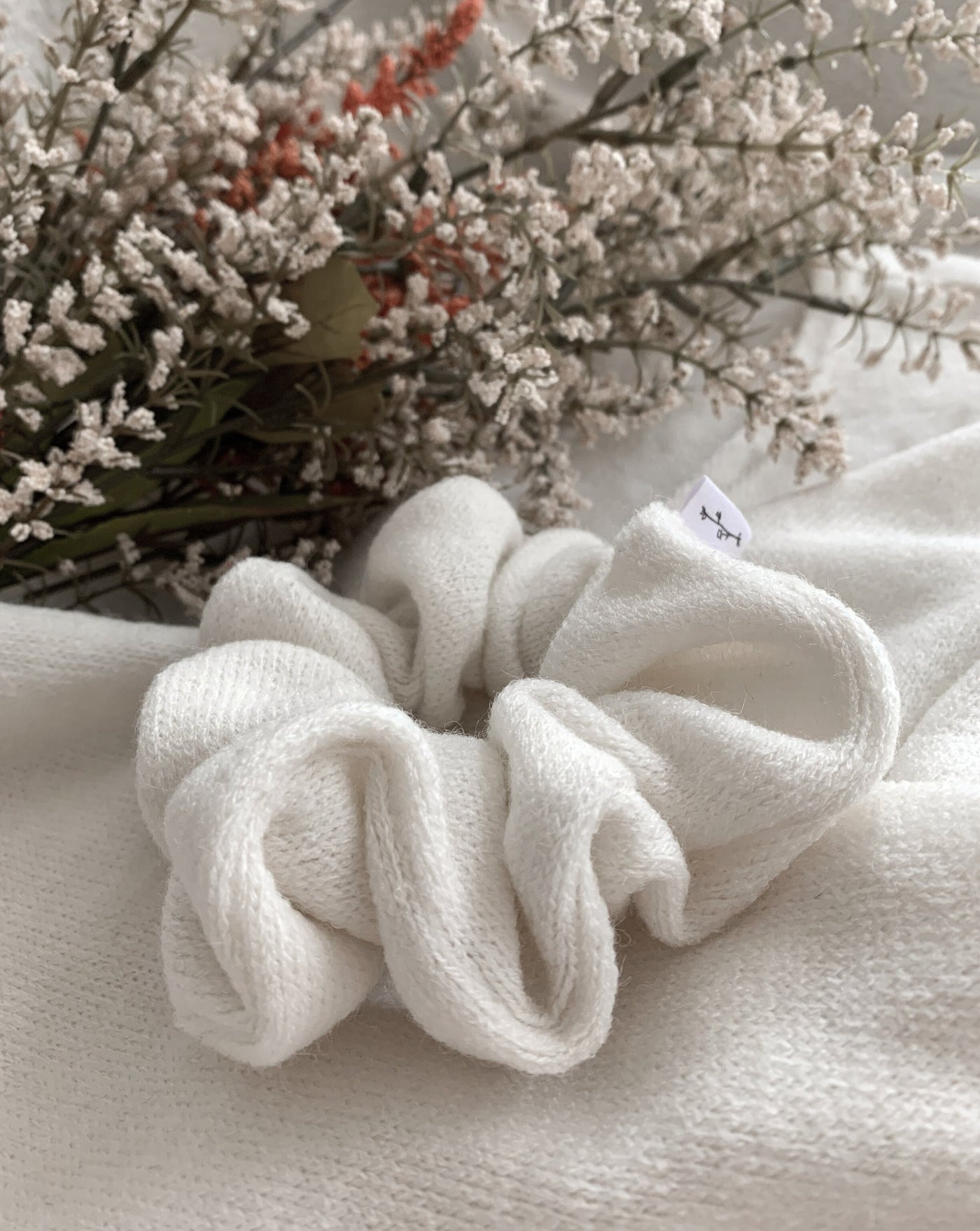 Cream oversized reclaimed sweater fabric scrunchie ethically sewn in Canada.