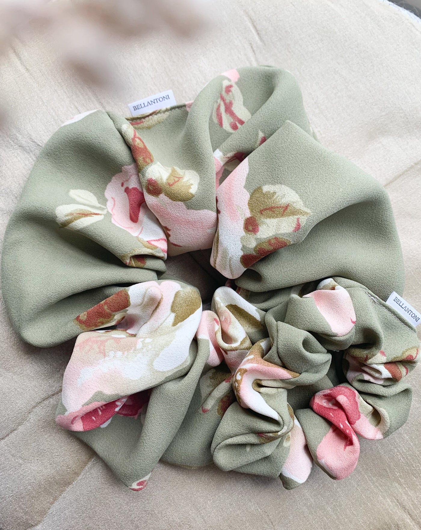 One Grande Luxe and classic floral green scrunchie flat lay.