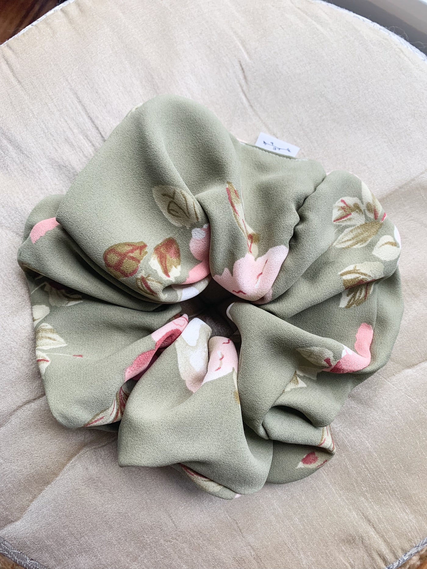 Grande Luxe floral green scrunchie flat lay.