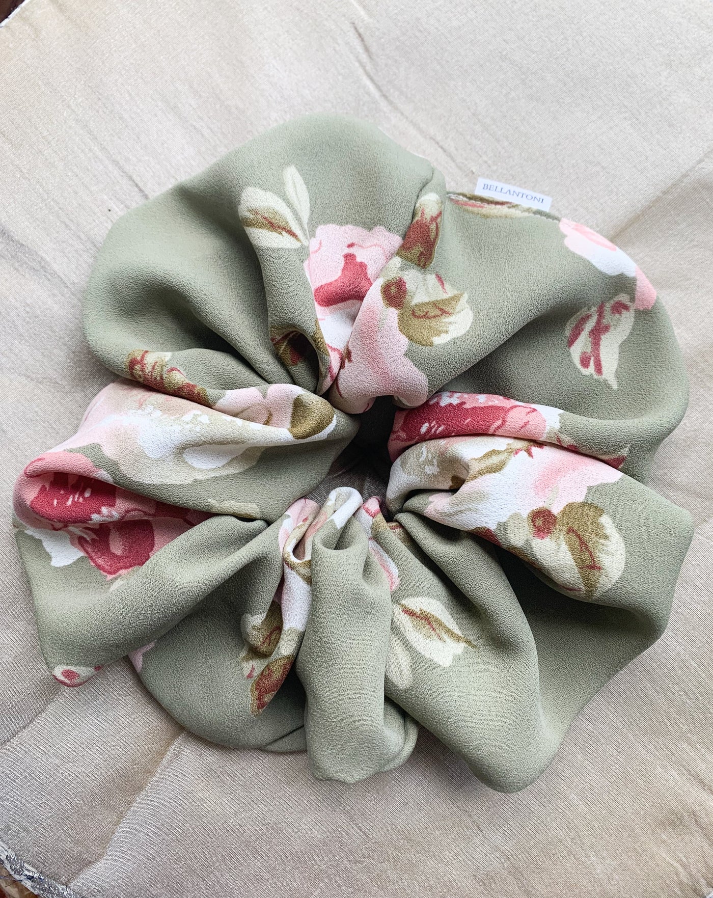 Grande Luxe floral green scrunchie flat lay.
