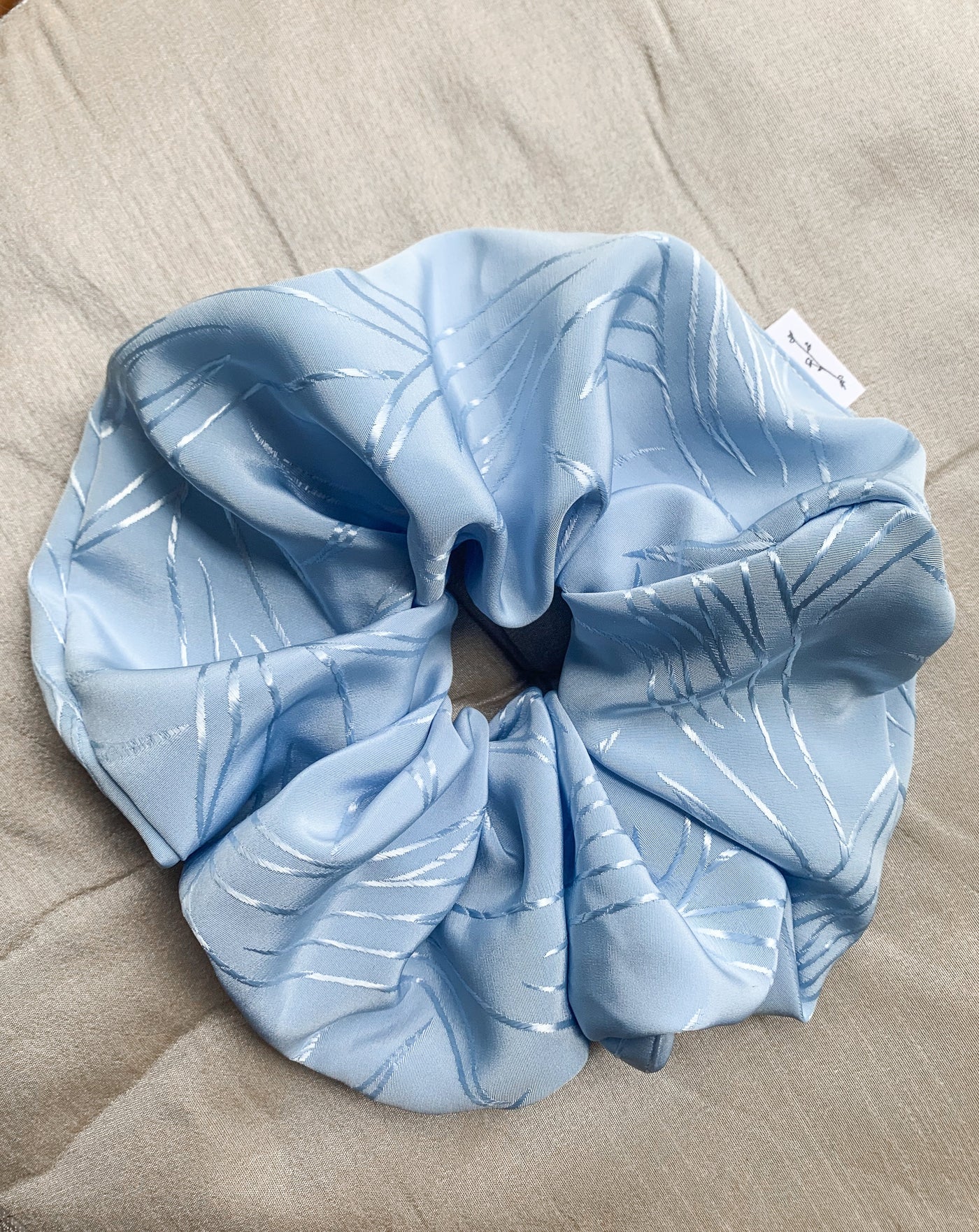 Grande Luxe frozen blue scrunchie flat lay.