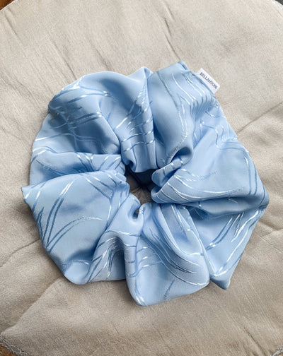 Grande Luxe frozen blue scrunchie flat lay.