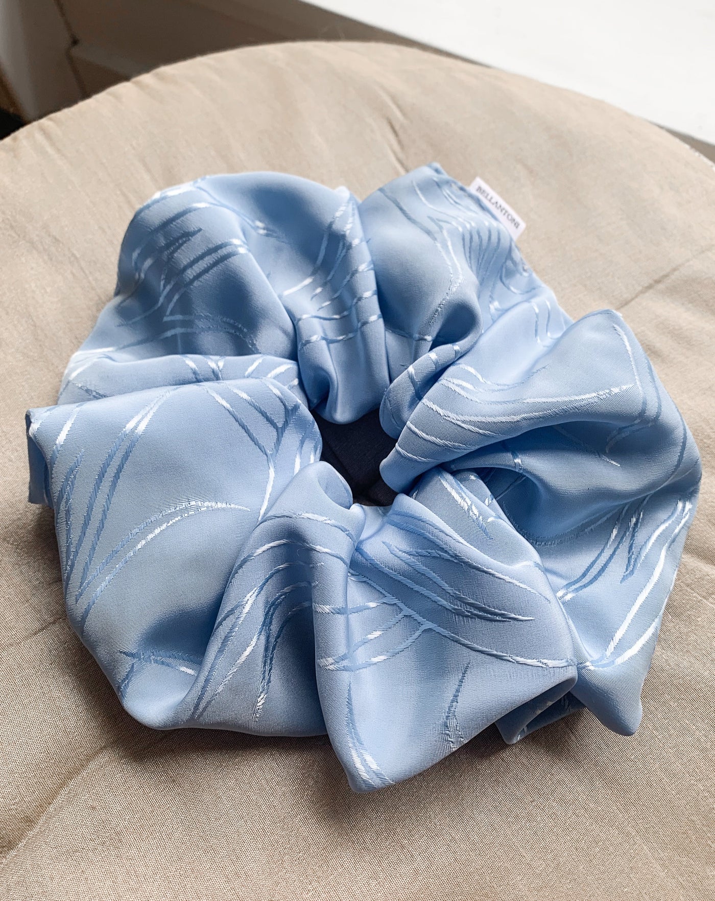 Grande Luxe frozen blue scrunchie flat lay.