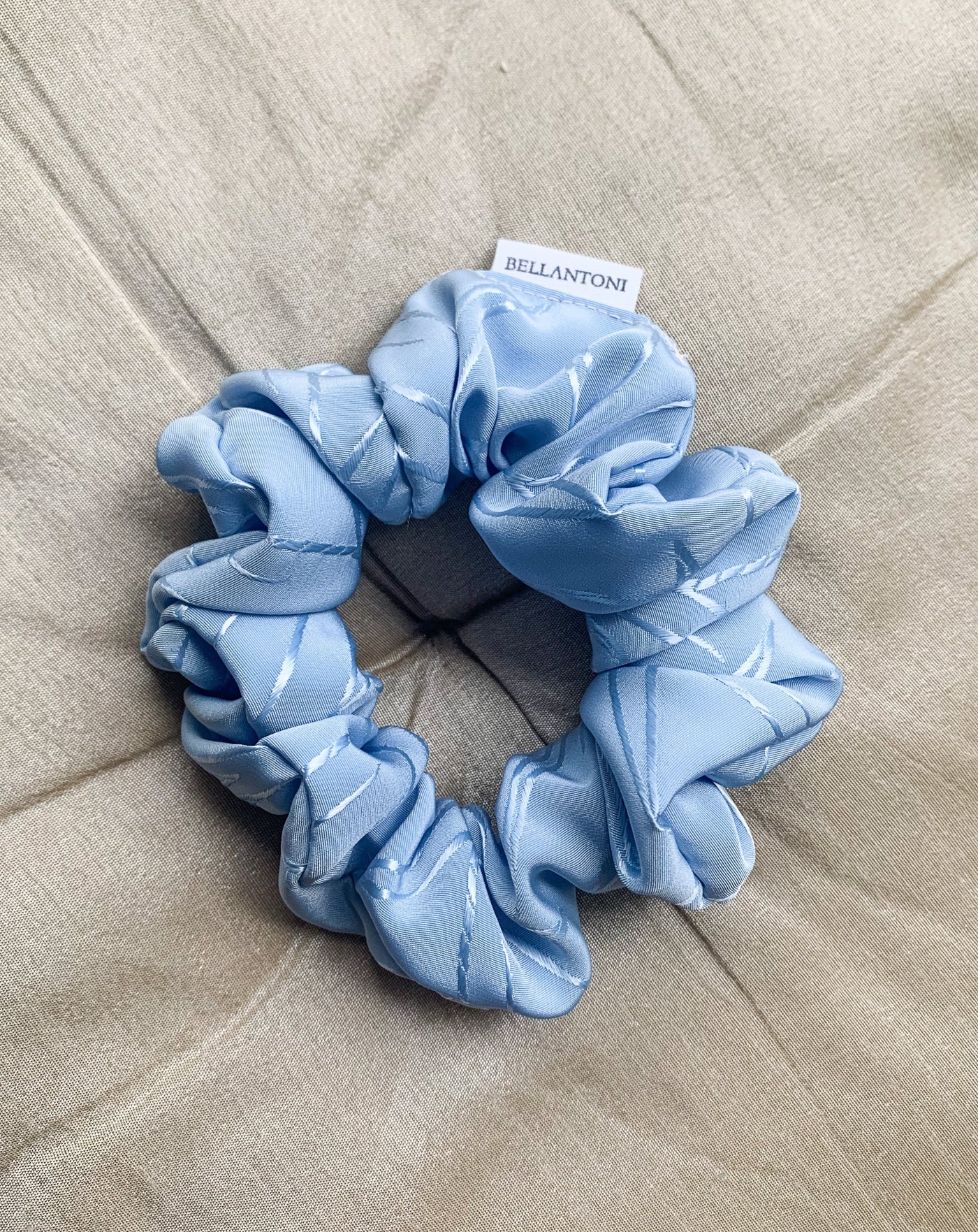 Frozen blue shine floral decal scrunchie flat lay.
